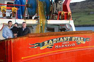 (L-R) Radiant Star crewman Marvin Inkster, his son Zac and skipper Victor Laurenson.